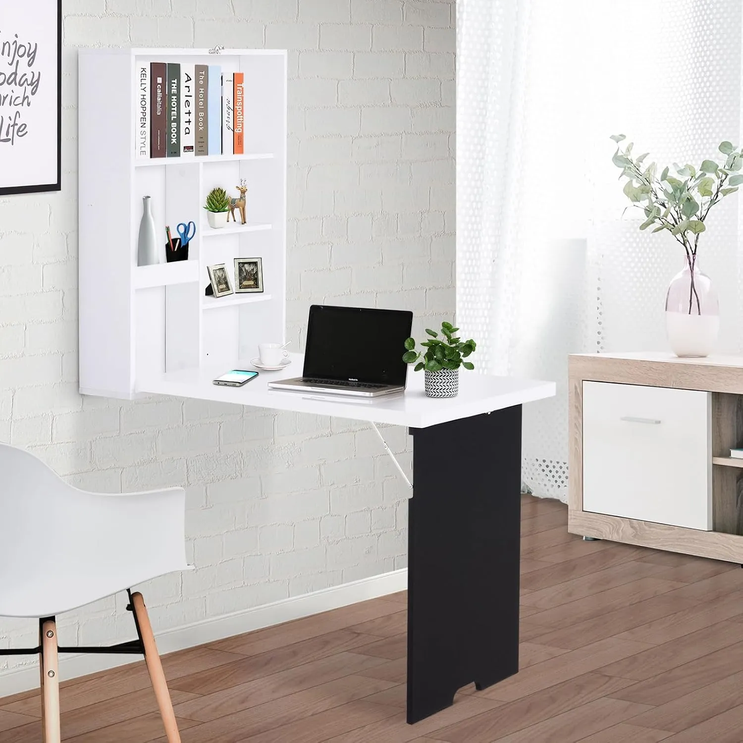HOMCOM white wall-mounted fold-down desk open with a laptop on the worktop and books on the built-in shelves