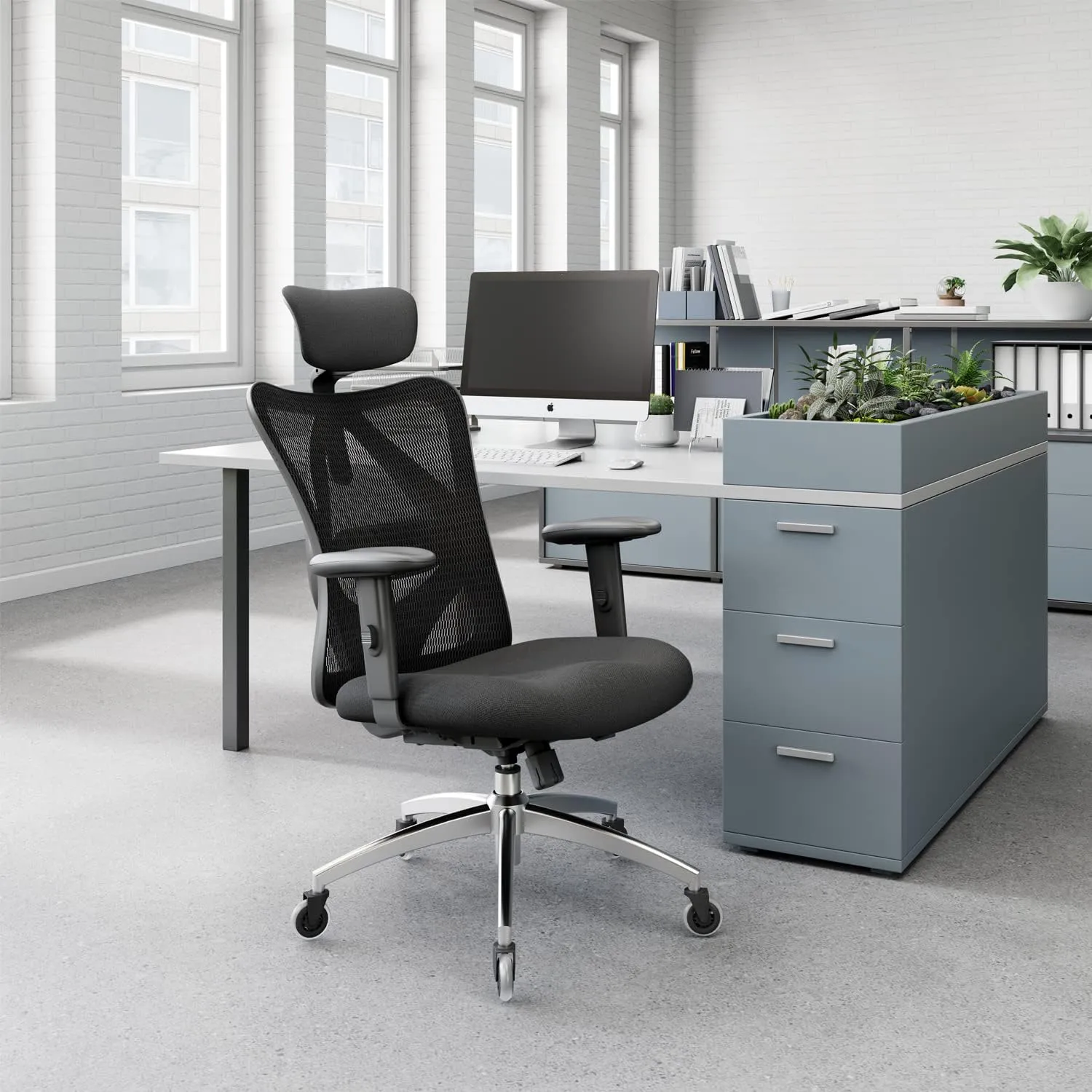 Sihoo M18 ergonomic office chair in black mesh beside a compact desk