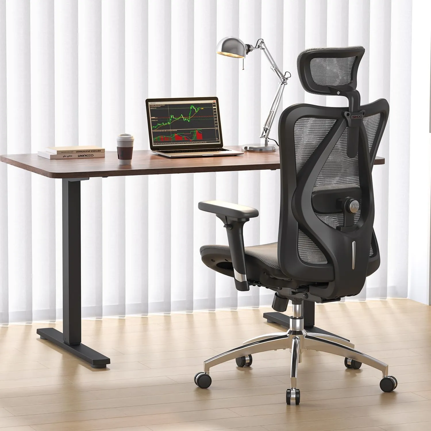 Sihoo M57 ergonomic office chair in grey mesh, shown at a desk in a small home office